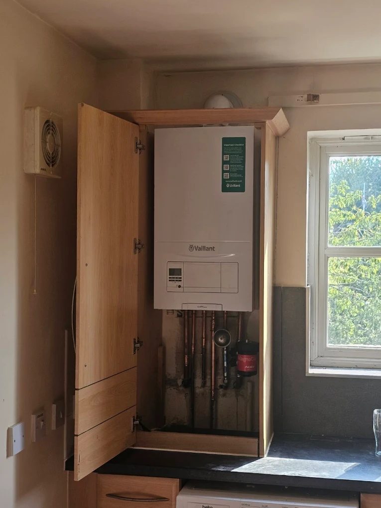 Vaillant boiler fitted in a kitchen cupboard